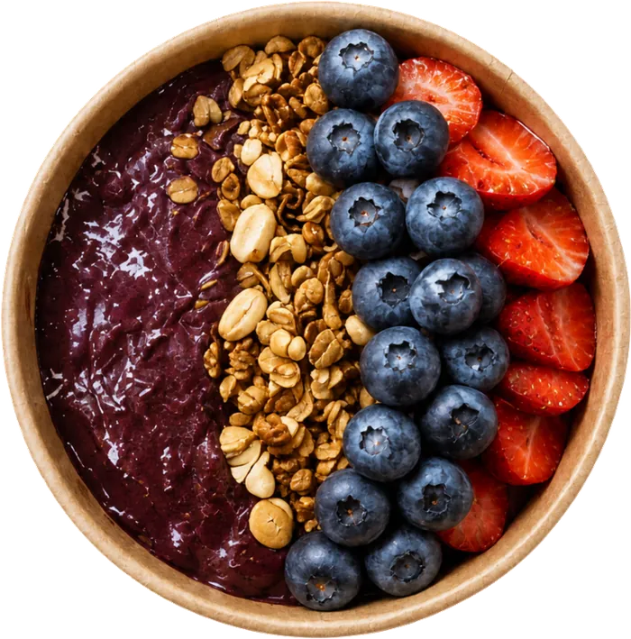 Bowl de açaí con plátano, granola y frutos rojos